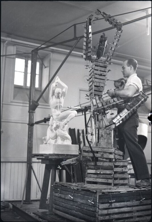 DuPen building the armature for The Eternal Struggle at Yale, circa 1936